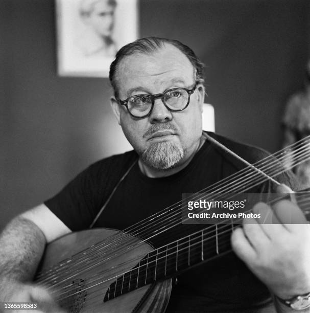 American actor, singer and musician Burl Ives playing an oud, USA, 1959. He won the Academy Award for Best Supporting Actor that year, for his role...