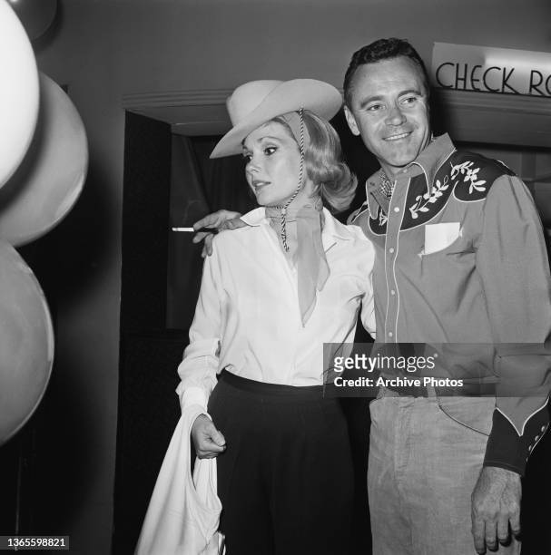 American actor Jack Lemmon and his wife Felicia at the SHARE Boomtown benefit party at the Moulin Rouge nightclub in Hollywood, USA, circa 1960.