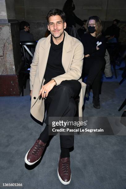 Johannes Huebl attends the Ami Fall/Winter 2022/2023 show as part of Paris Fashion Week on January 19, 2022 in Paris, France.