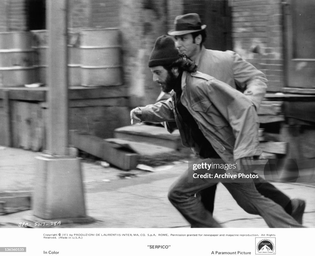 Al Pacino running to apprehend suspected drug dealer in a scene from
