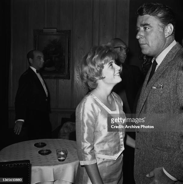 American actress Patty Duke with actor and producer Peter Lawford at a party hosted for her at Chasen's restaurant in West Hollywood, California,...