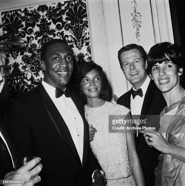 From left to right, American actor Bill Cosby, his wife Camille, actor Robert Culp and his wife Nancy at the opening of American jazz singer Nancy...
