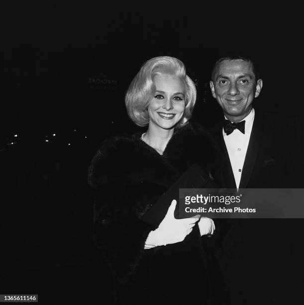 American film and television producer Aaron Spelling with actress Diane McBain at a party for the film 'The Greatest Story Ever Told', USA, 1965.