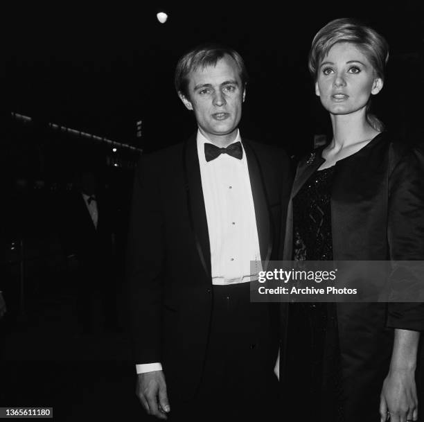 British actor David McCallum and his wife, actress Jill Ireland at a party for the film 'The Greatest Story Ever Told', USA, 1965.