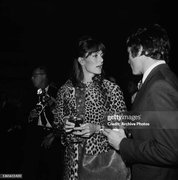 English actress Vanessa Redgrave with actor Franco Nero at a press party for the musical film 'Camelot', in which they both star, USA, 1966.