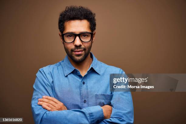 confident businessman in blue denim shirt - denim shirt stock pictures, royalty-free photos & images