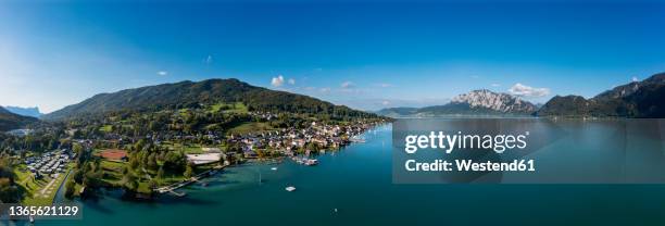 austria, upper austria, unterach am attersee, drone panorama of lake atter and lakeshore village - attersee stock pictures, royalty-free photos & images