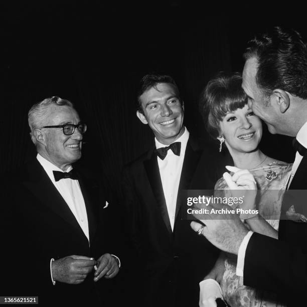 American actor Anthony Franciosa and his wife Judy Balaban with directors Vittorio De Sica and George Sidney at the Directors' Guild of America...