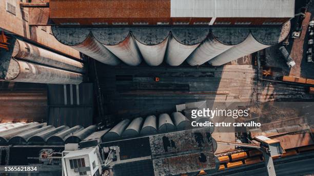cereal silos and trucks from above - unloading stockfoto's en -beelden