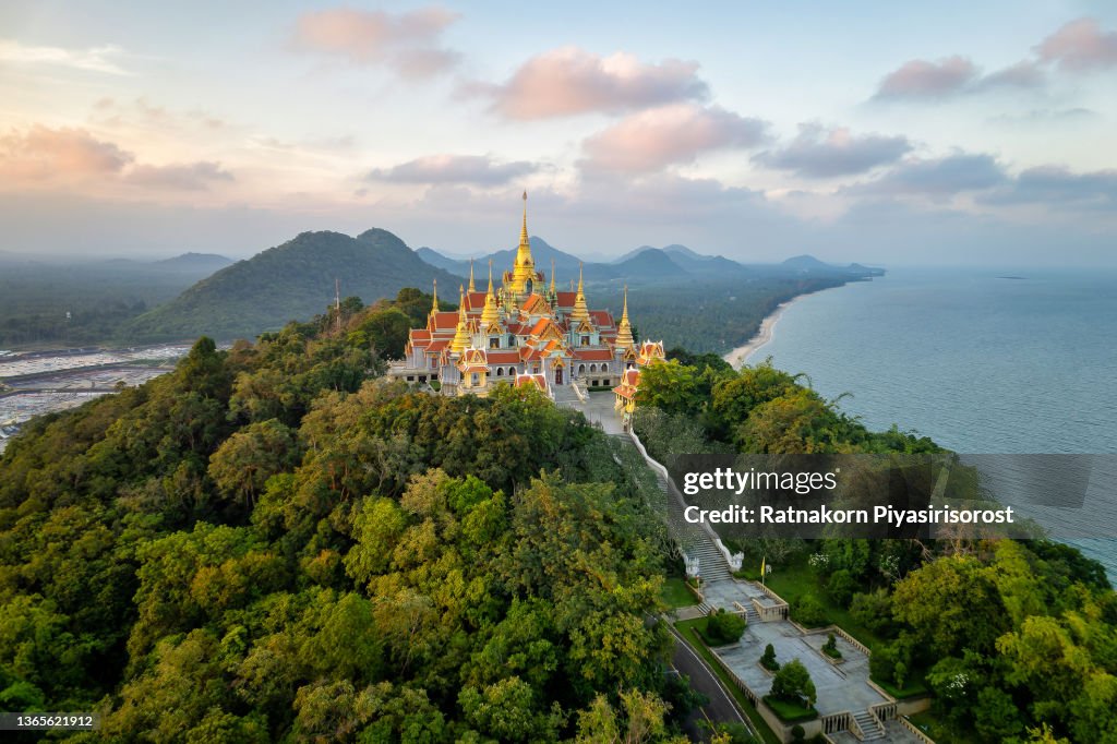 Aerial Drone Sunset Scene of Pagodas at Pramahatart Chedi Pakdepragard, Wat Tang Sai temple, Ban Krut, Bang Saphan, Prachuap Khirikhan, Thailand