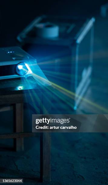 close-up of illuminated projector, film, led, home cinema. - searchlight stock pictures, royalty-free photos & images