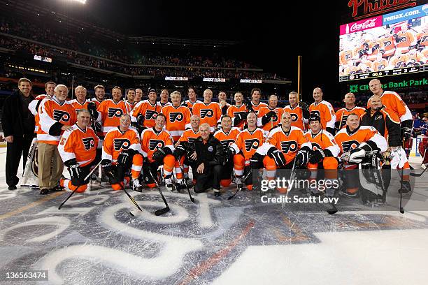 The Philadelphia Flyers alumni pose for a team photo after defeating the New York Rangers alumni at Citizens Bank Park during the 2012 Bridgestone...