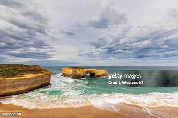 australia, victoria, view of london arch in port campbell national park - bass strait stock pictures, royalty-free photos & images