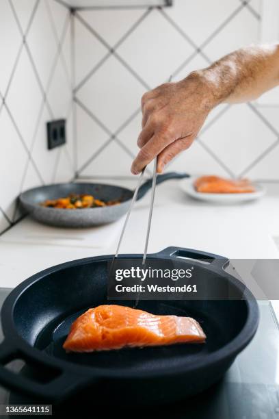 Man Frying Fish Man Frying Fish Photos and Premium High Res Pictures - Getty Images