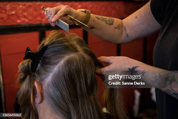 Hairdressor is working in 'De Roode Bioscoop' a small theatre, on January 19, 2022 in Amsterdam, Netherlands. The country's cultural venues, such as...