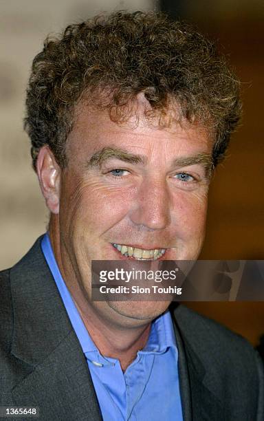 Television presenter Jeremy Clarkson smiles for photographers as he arrives at the "GQ Magazine Men of the Year Awards" September 3, 2002 at the...