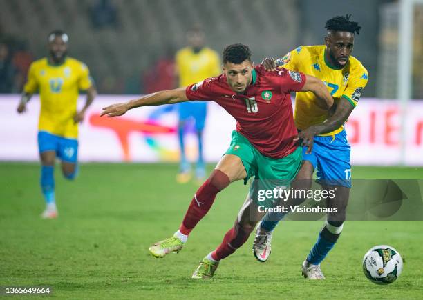 Of Gabon and SELIM AMALLAH of Morocco during the Group C Africa Cup of Nations 2021 match between Gabon and Morocco at Stade Ahmadou Ahidjo in...