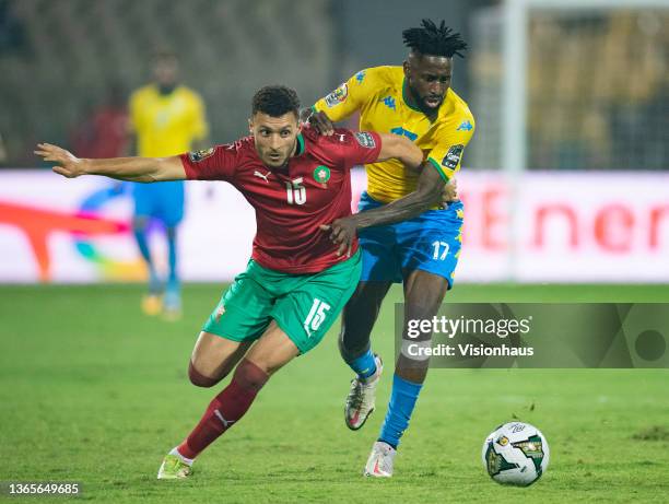Of Gabon and SELIM AMALLAH of Morocco during the Group C Africa Cup of Nations 2021 match between Gabon and Morocco at Stade Ahmadou Ahidjo in...