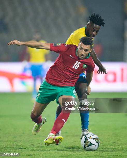 Of Gabon and SELIM AMALLAH of Morocco during the Group C Africa Cup of Nations 2021 match between Gabon and Morocco at Stade Ahmadou Ahidjo in...