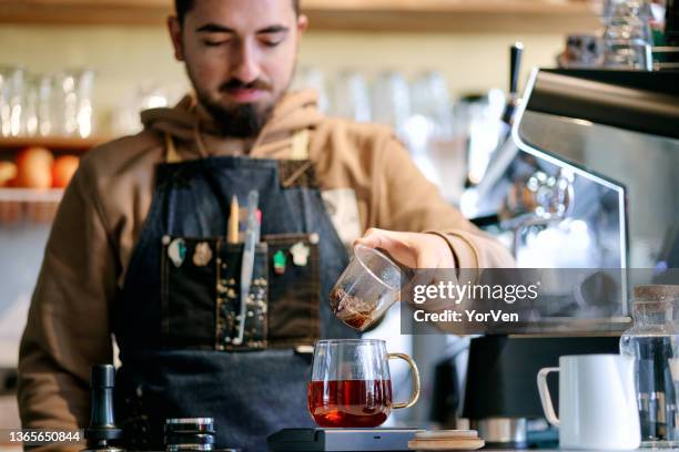 barista making tea - making tea stock pictures, royalty-free photos & images