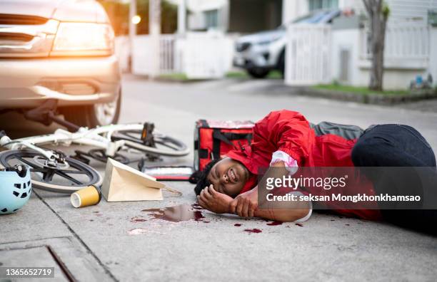 traffic accident.young man hit by a car - dead bodies in car accident photos stock pictures, royalty-free photos & images