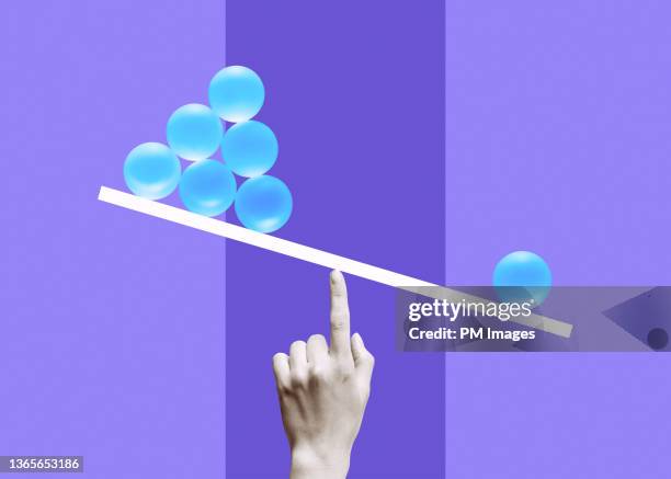 balanced on a black and white finger - opposite opinion stock pictures, royalty-free photos & images