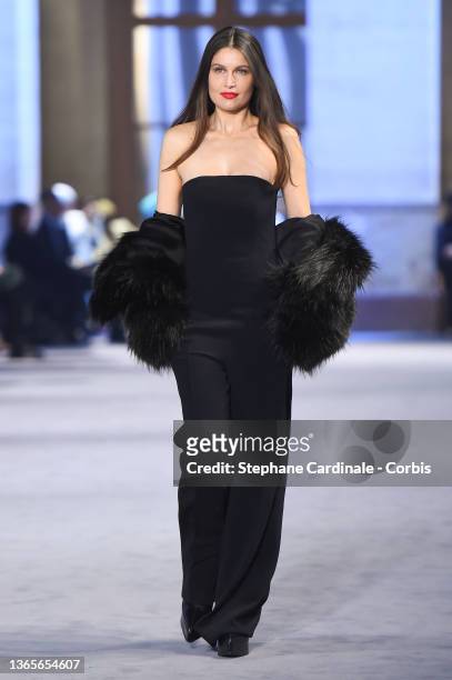 Laetitia Casta walks the runway during the Ami Menswear Fall/Winter 2022-2023 show as part of Paris Fashion Week on January 19, 2022 in Paris, France.