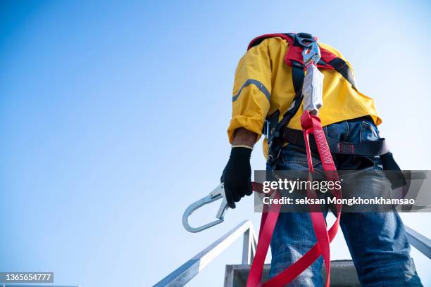 safety when working at height. equipment for working at height - red guards stockfoto's en -beelden