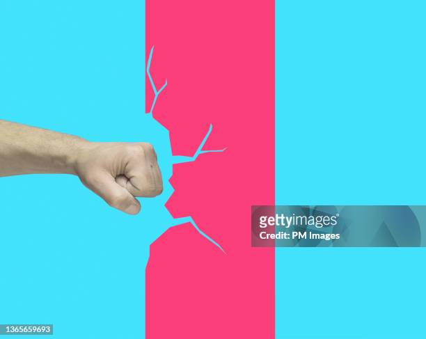 punching the wall - anger fist stock pictures, royalty-free photos & images