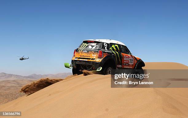 Ricardo Leal Dos Santos of Portugal drives his Mini over a sand dune during stage seven of the 2012 Dakar Rally from Copiapo to Copiapo on January 7,...