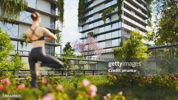 green living - rooftop yoga stock pictures, royalty-free photos & images