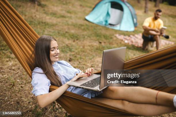 young couple camping in forest - labor camp bildbanksfoton och bilder