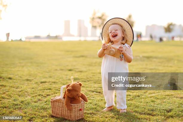 cute little girl having fun time in the nature - toy camera stock pictures, royalty-free photos & images
