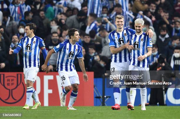 Alexander Soerloth of Real Sociedad celebrates with Adnan Januzaj after scoring their team's second goal during the Copa Del Rey match between Real...
