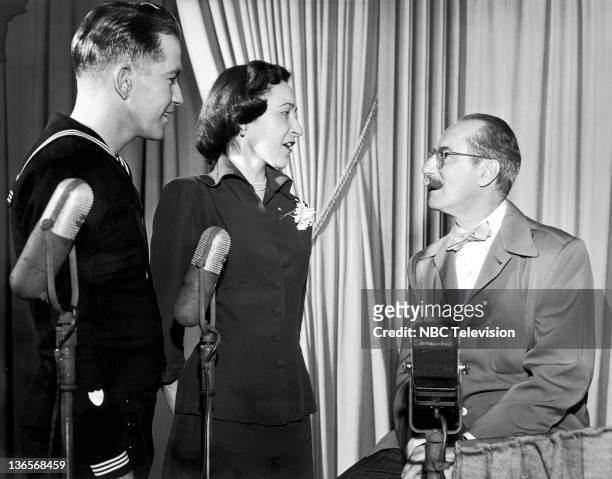 Contestants Gene Scarcliff and Nancy Dunn with host, Groucho Marx on the TV quiz show 'You Bet Your Life', 11th April 1951. Scarcliff and Dunn won...