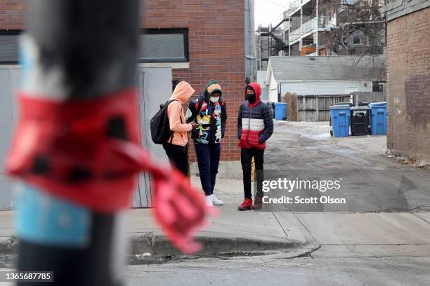 Remnants of red crime scene tape remain attached to a pole as friends and classmates visit the location where 15-year-old Caleb Westbrooks was killed...
