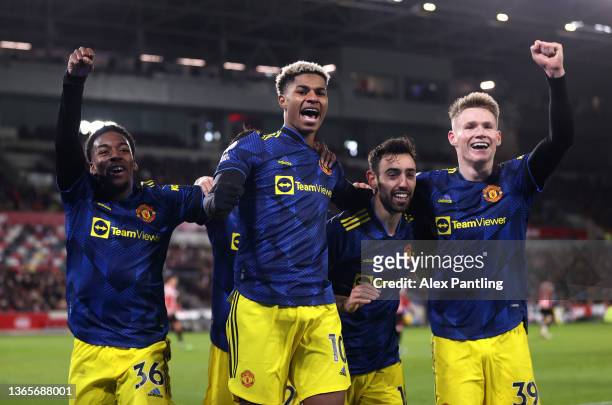 Marcus Rashford of Manchester United celebrates with teammates Anthony Elanga, Bruno Fernandes and Scott McTominay after scoring their side's third...