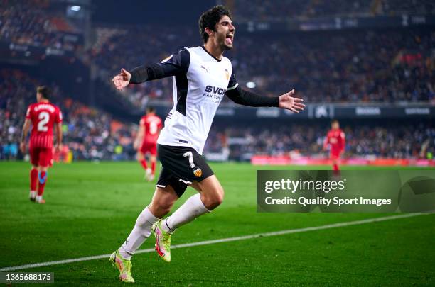 Gonzalo Guedes of Valencia CF celebrates his team's first goal during the La Liga Santander match between Valencia CF and Sevilla FC at Estadio...