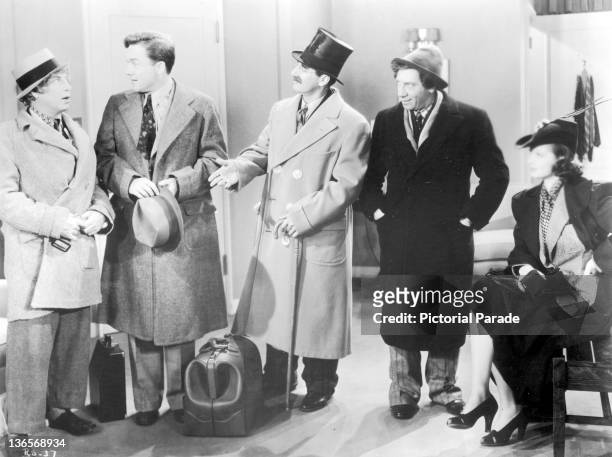 Scene from the Marx Brothers comedy 'Room Service', directed by William A Seiter, 1938. Left to right: Harpo Marx , Frank Albertson , Groucho Marx ,...