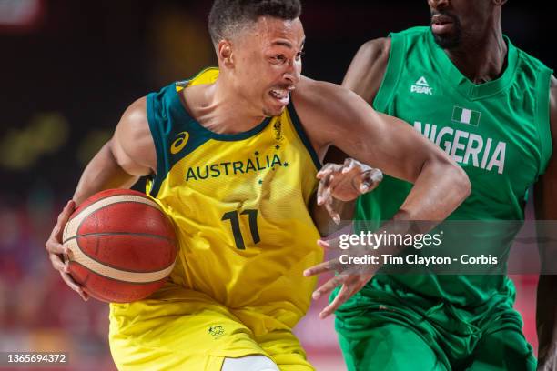 Dante Exum of Australia defended by Ekpe Udoh of Nigeria during the Australia V Nigeria basketball preliminary round match at the Saitama Super Arena...