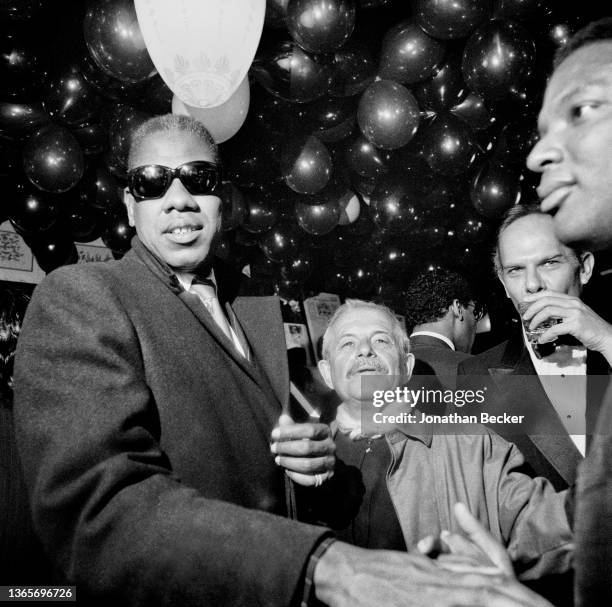 Fashion editor and stylist Andre Leon Talley, illustrator Joe Eula, Unknown and Quentin Yerby are photographed at Elaine's 25th Anniversary Party on...