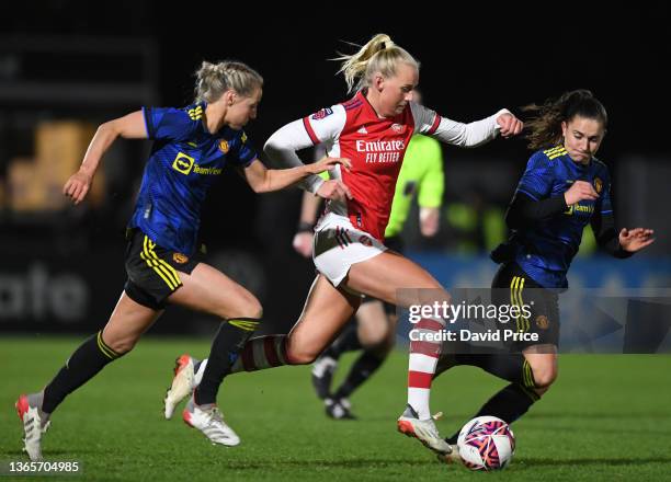 Stina Blackstenius of Arsenal takes on Millie Turner and Vilde Boa Risa of Man Utd during the FA Women's Continental Tyres League Cup Quarter Final...