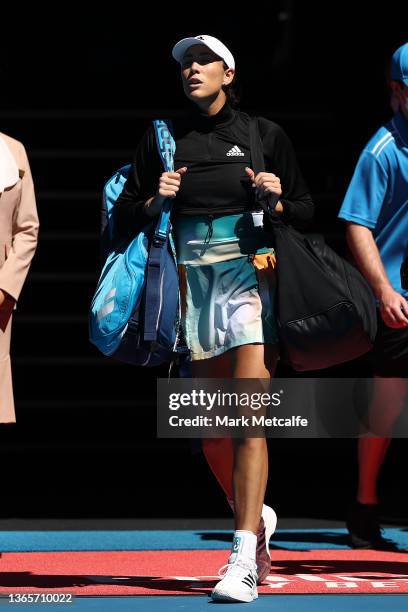 Garbine Muguruza of Spain walks onto Rod Laver Arena ahead of her second round singles match against Alize Cornet of France during day four of the...