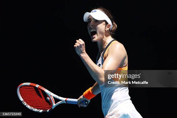 Alize Cornet of France celebrates after winning a point in her second round singles match against Garbine Muguruza of Spain during day four of the...