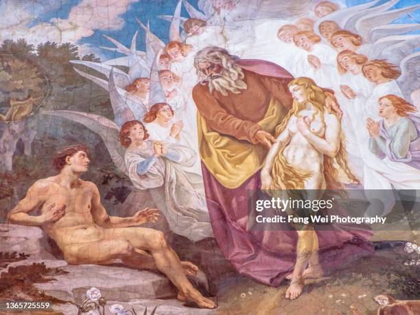 fresco painting depicting god bringing eve to adam in the garden of eden, dakovo cathedral (cathedral of st. peter), dakovo, croatia - god fotografías e imágenes de stock