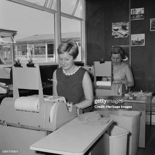 Aylesbury Estate, Walworth, Southwark, London, . Two women working in the computer room of Laing's construction site at the Aylesbury Estate. In...