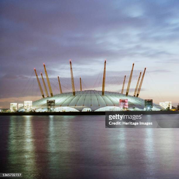 Millennium Dome, Drawdock Road, Greenwich, London, . An exterior view of the Millennium Dome at dusk from the north, across the Thames. Artist John...