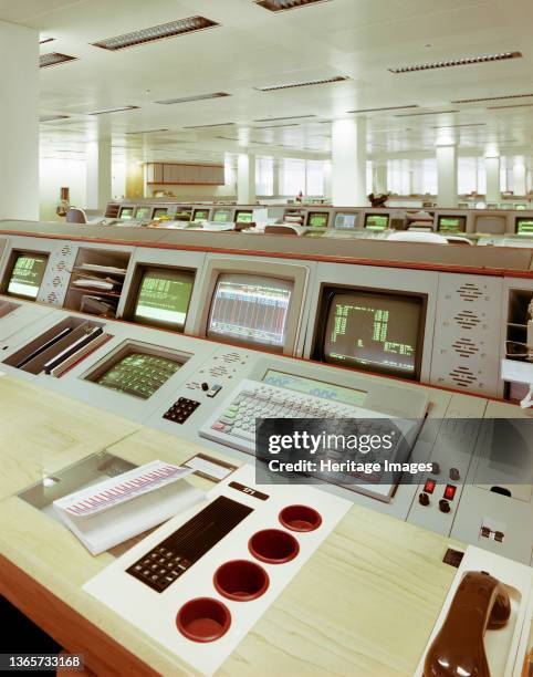 Cottons Centre, Tooley Street, London Bridge, Southwark, London, . A bank of computer screens in an office of the Canadian Imperial Bank of Commerce...