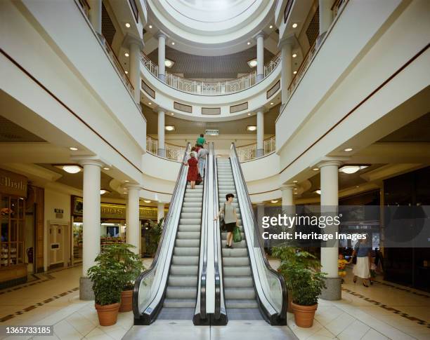 Eldon Garden shopping centre, Percy Street, Newcastle upon Tyne, . Shoppers using the escalators in the Rotunda section of the Eldon Garden shopping...