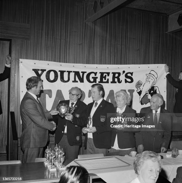 Laing Sports Ground, Rowley Lane, Elstree, Barnet, London, . The winning team of a Mixed Triples Bowls Tournament being presented with a shield by...